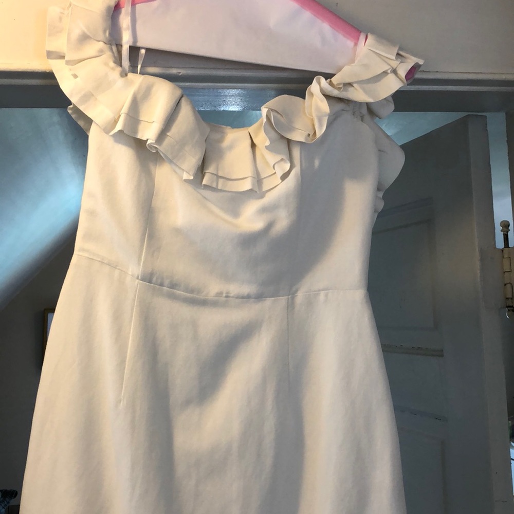 by the way. White mini ruffle dress